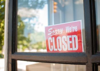 Closed sign in a store window.